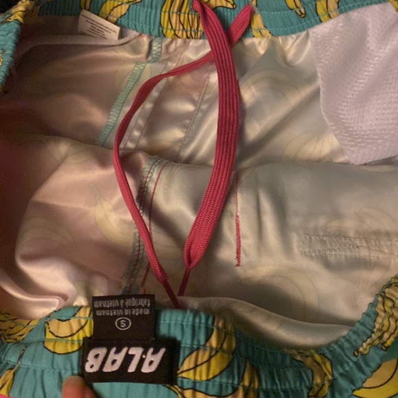 Swimming trunks teal and pink yellow banana pattern and there a small - Picture 3 of 4